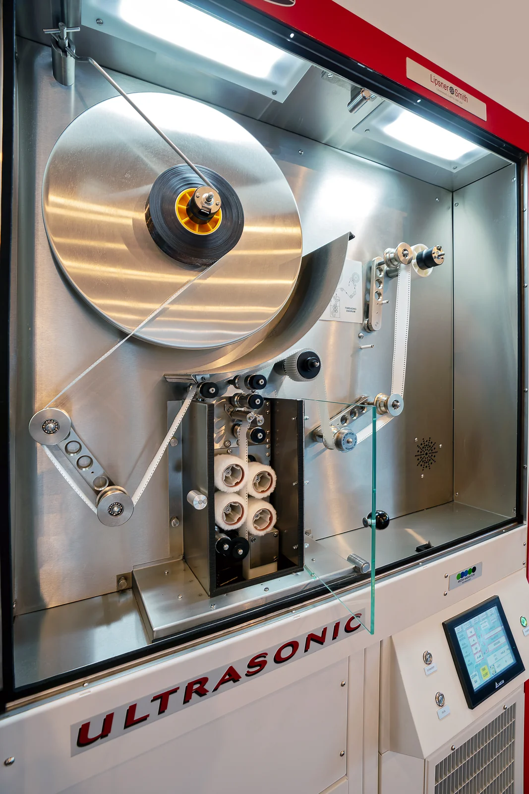 MMT CF9400HFE ultrasonic film cleaner — front view with film loaded